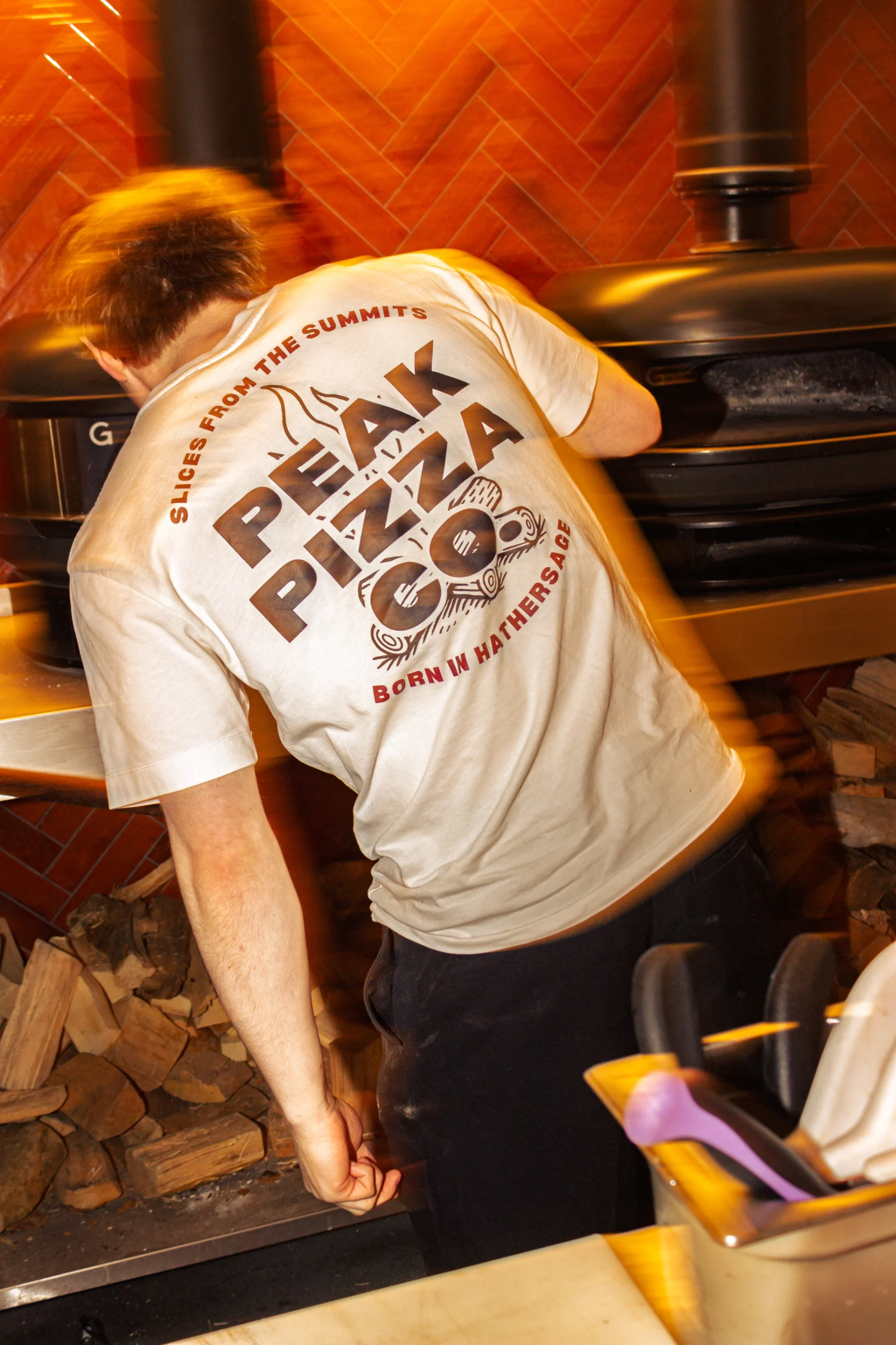 Pizza chef in the pizza kitchen at Peak Pizza Co.