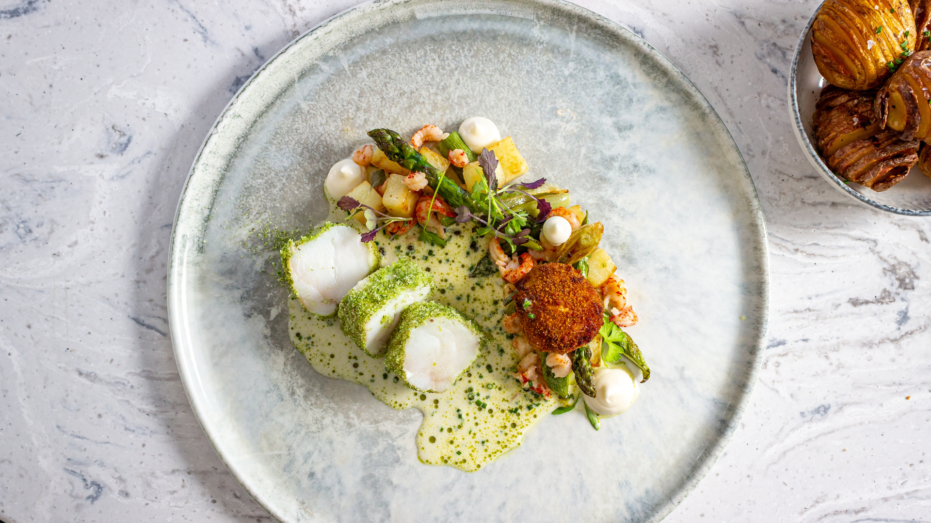 A fine dining seafood dish with cod and crayfish tails at Bank House
