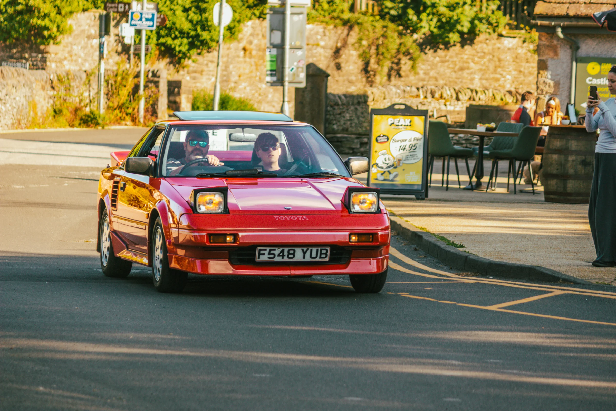 A sports car arriving at Peak Motor Club at Castleton Kitchen / Peak Burger Co. / Castleton Visitors Centre